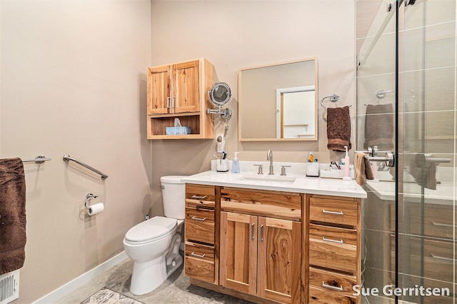 full bathroom with a shower stall, toilet, vanity, and baseboards