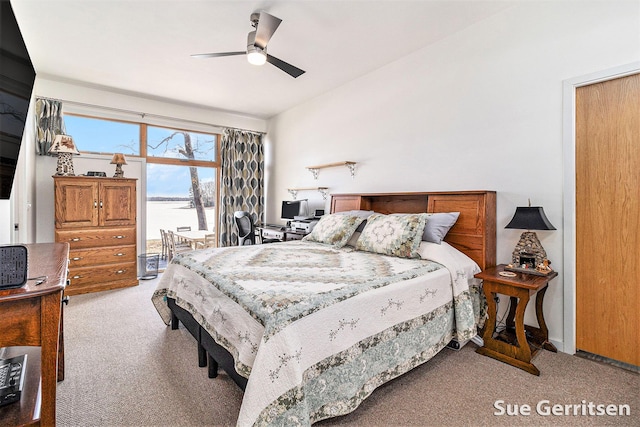 bedroom featuring access to outside, light colored carpet, and ceiling fan