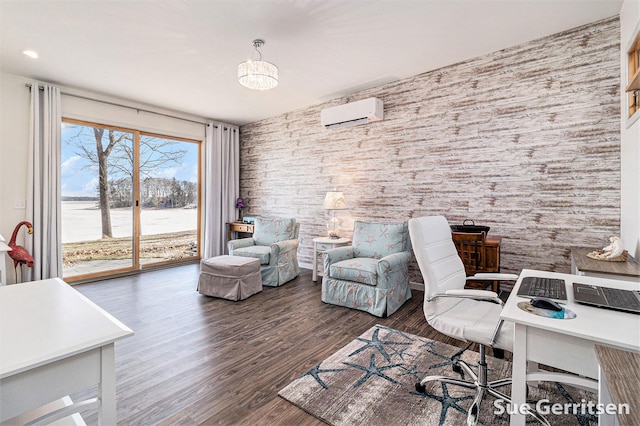 home office featuring an inviting chandelier, wood finished floors, and a wall mounted AC