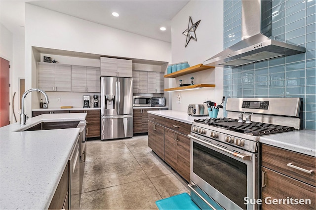 kitchen with open shelves, recessed lighting, stainless steel appliances, wall chimney range hood, and tasteful backsplash