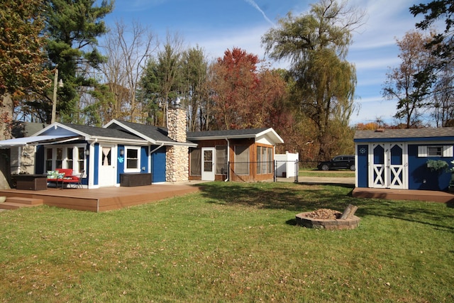 view of yard with an outbuilding and fence