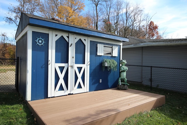 view of shed with fence