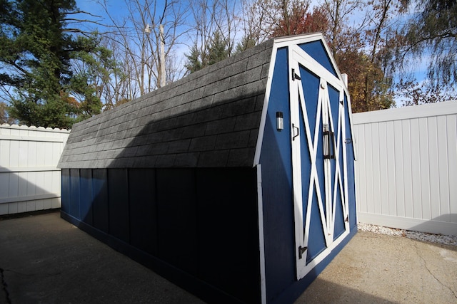 view of shed with a fenced backyard