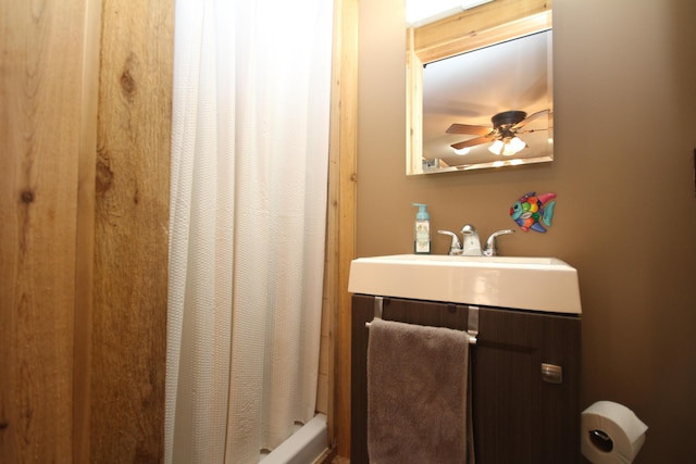 full bathroom with vanity and ceiling fan