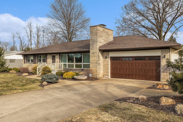 view of front of home with stone siding, concrete driveway, a garage, and a shingled roof