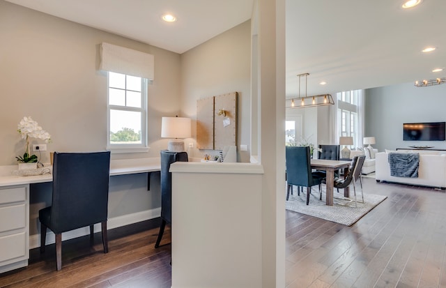 office area with recessed lighting, baseboards, wood finished floors, and built in study area