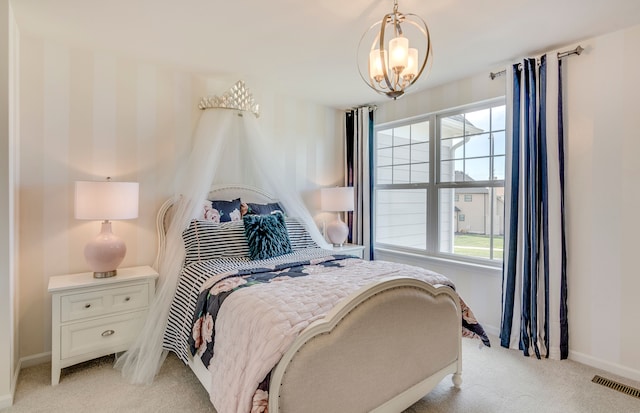 bedroom with visible vents, multiple windows, light colored carpet, and baseboards