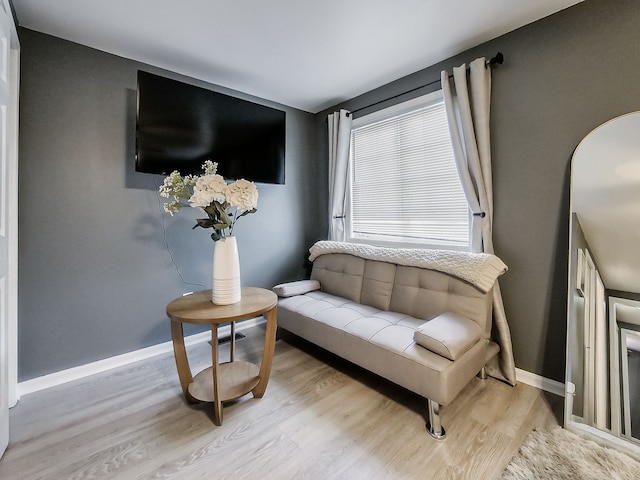 sitting room featuring wood finished floors and baseboards