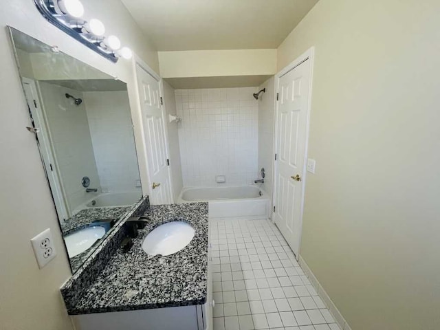 full bathroom with tile patterned flooring, shower / washtub combination, vanity, and baseboards