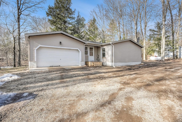 view of front of home with a garage and driveway