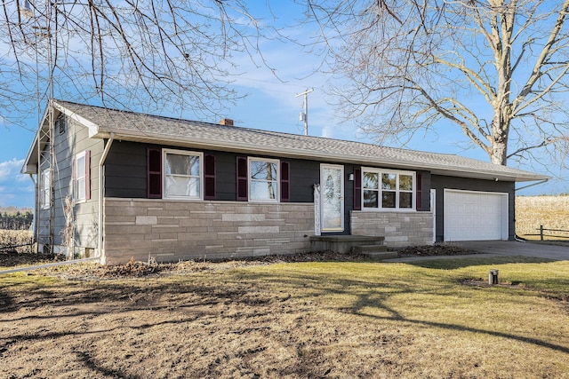 single story home with an attached garage, a chimney, a front lawn, concrete driveway, and stone siding