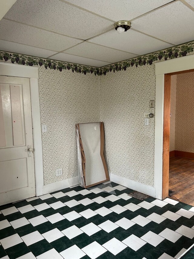 1406 W Ottawa St W, Lansing, MI 48915 - spare room with light floors, baseboards, and wallpapered walls