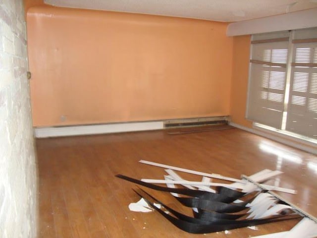 empty room with wood finished floors