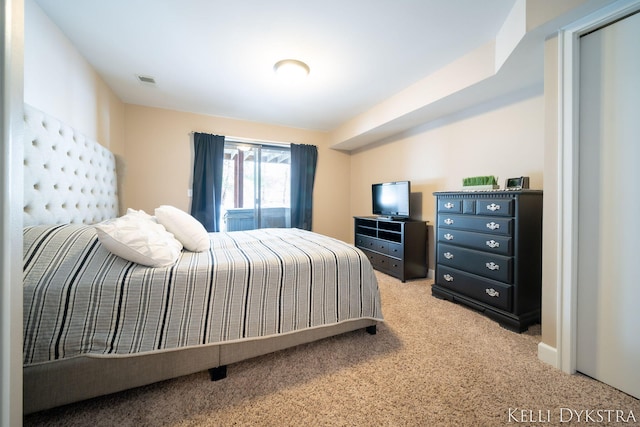 carpeted bedroom with visible vents