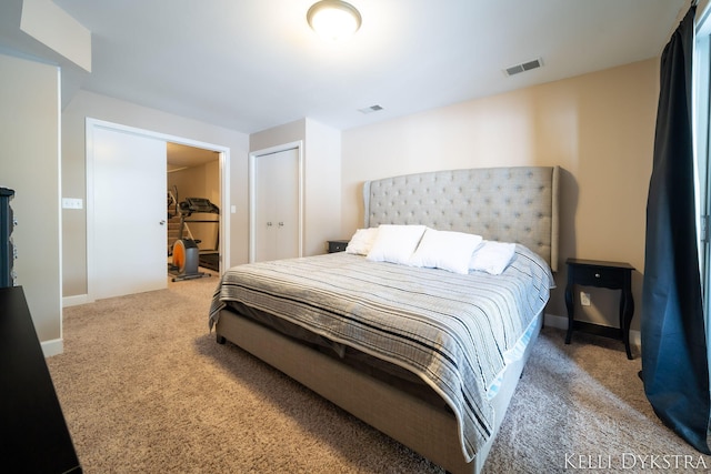 bedroom featuring visible vents, baseboards, and carpet floors