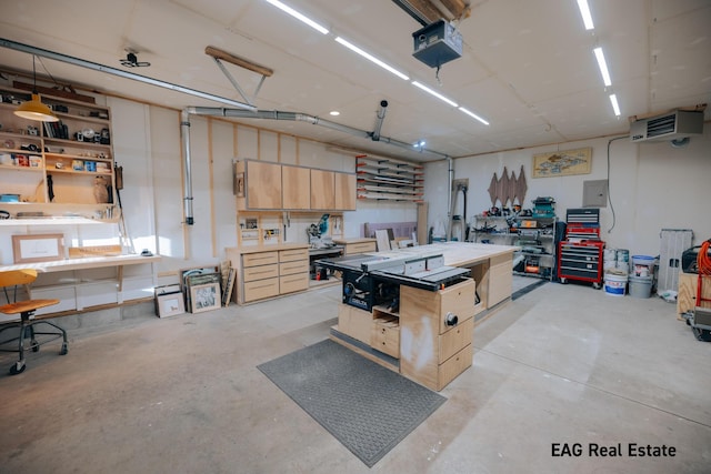 garage with electric panel, a workshop area, and a garage door opener