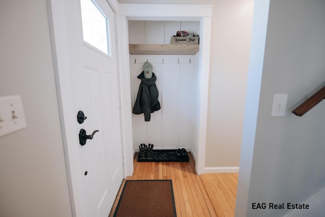 mudroom featuring baseboards and wood-type flooring