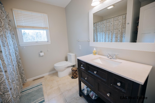 bathroom featuring visible vents, baseboards, toilet, tile patterned floors, and vanity