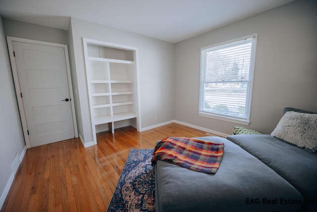 bedroom with baseboards and light wood-style floors