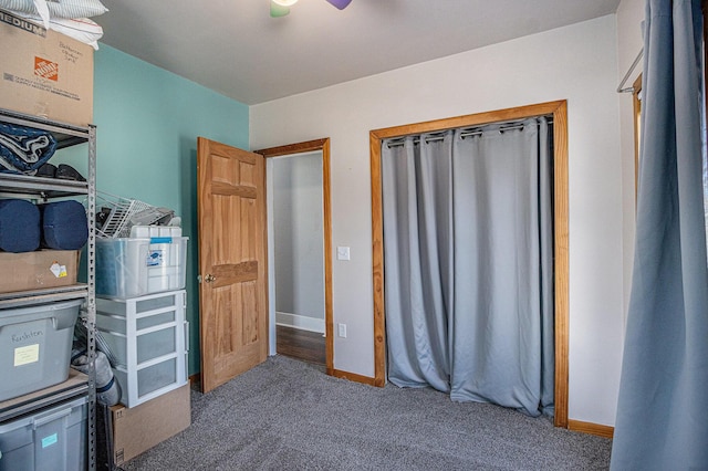 interior space with baseboards and ceiling fan