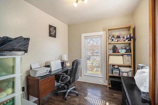 office area with dark wood finished floors and baseboards