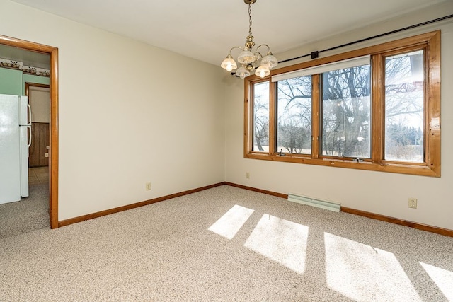 unfurnished room with a baseboard heating unit, light colored carpet, baseboards, and a chandelier