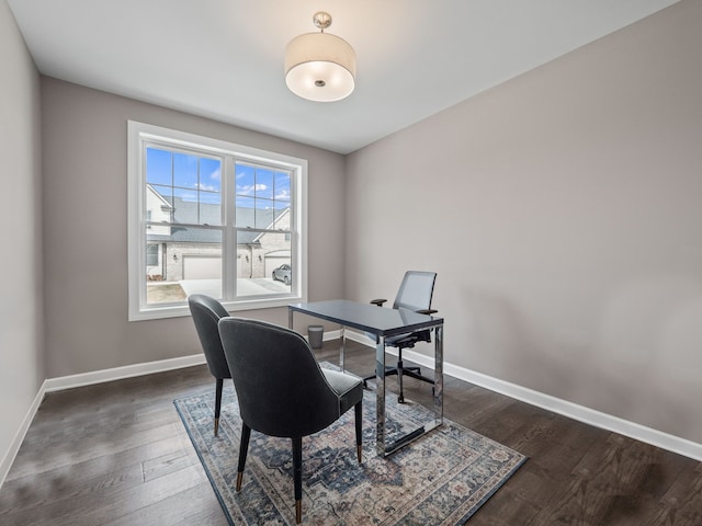 office with baseboards and dark wood-style flooring