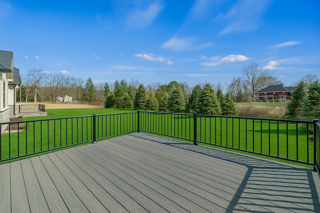 wooden terrace with a lawn