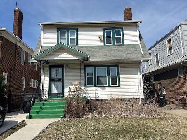 view of front of home featuring roof with shingles, a chimney, and fence