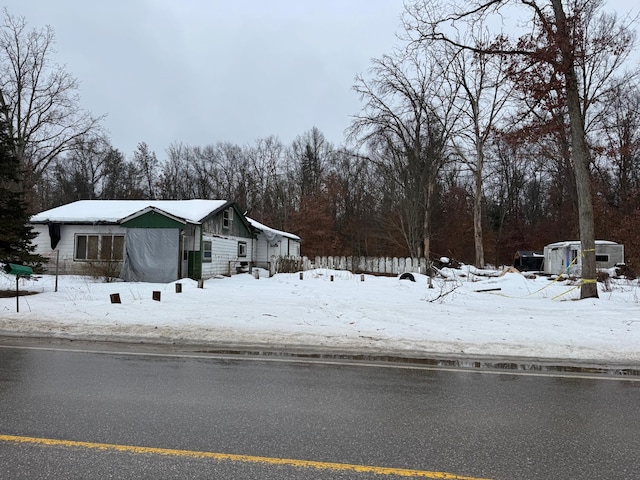 yard covered in snow featuring central air condition unit