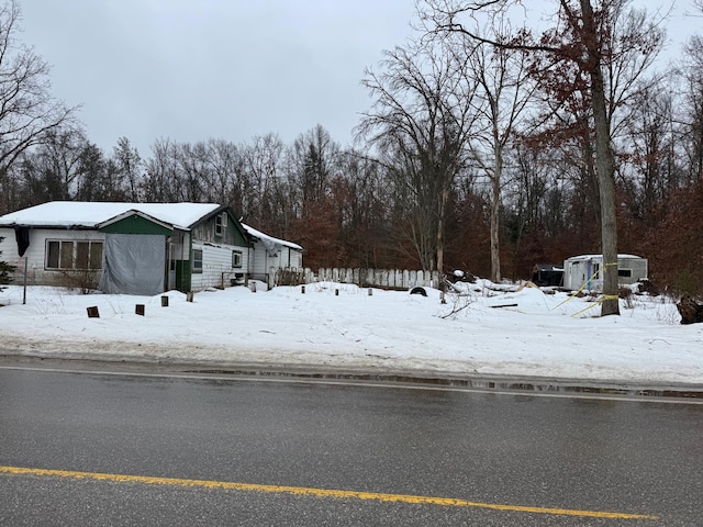 yard covered in snow with central AC unit