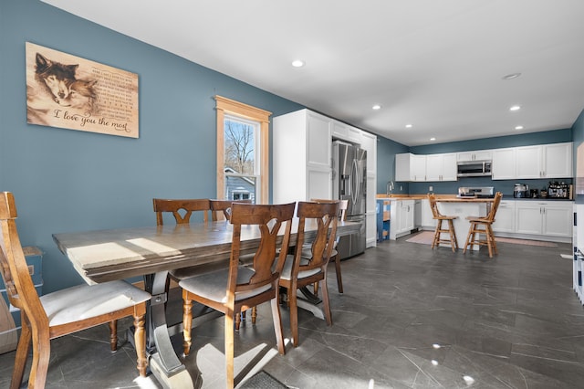 dining area featuring recessed lighting