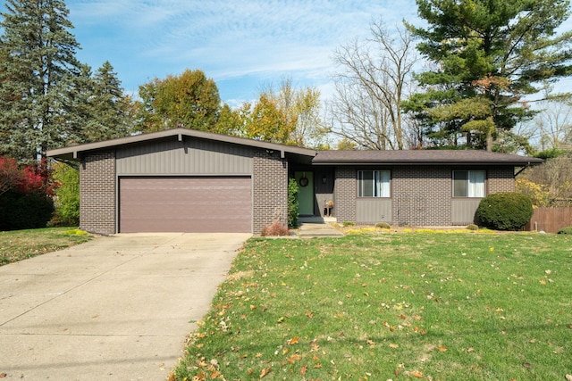 single story home with brick siding, a front lawn, concrete driveway, and an attached garage