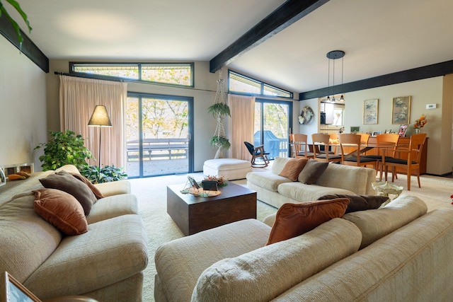 living area with vaulted ceiling with beams and carpet