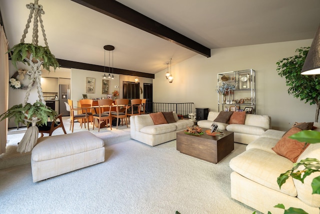 carpeted living area featuring lofted ceiling with beams