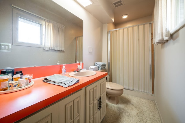 full bath featuring visible vents, a shower stall, vanity, and toilet