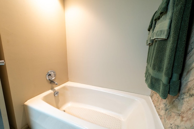 full bathroom with a tub to relax in