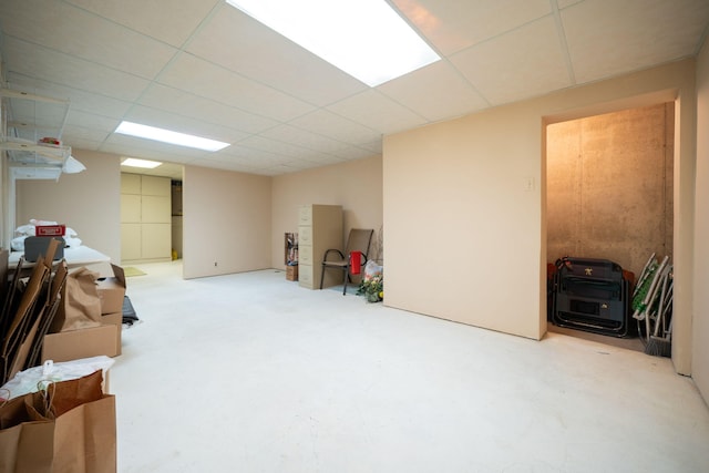 finished basement with a paneled ceiling