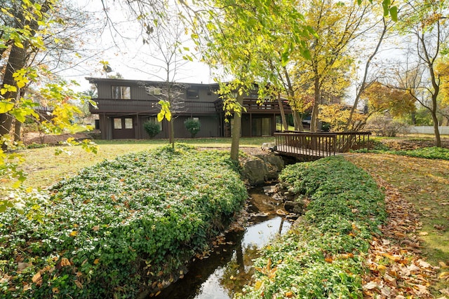 view of yard featuring a wooden deck