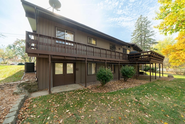 back of house with a lawn, central AC, and a deck