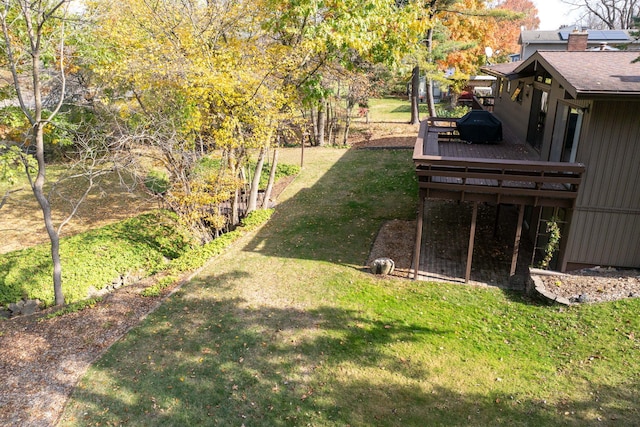 view of yard with a wooden deck