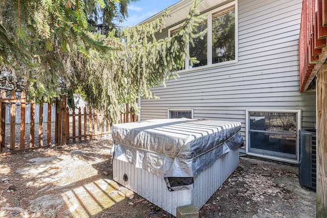 exterior details with central AC and fence