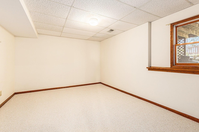 spare room featuring baseboards and carpet floors