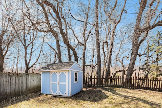 view of shed featuring a fenced backyard