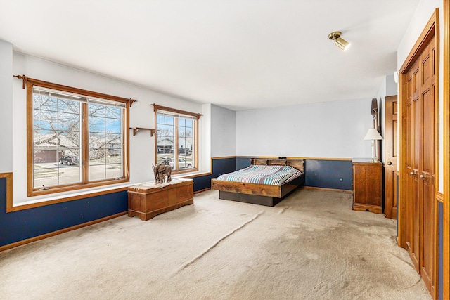 carpeted bedroom with a closet