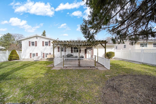 rear view of house featuring a patio area, a lawn, a pergola, and a fenced backyard