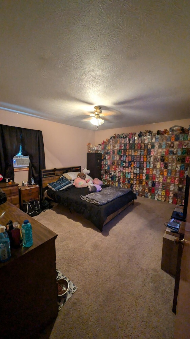 carpeted bedroom featuring a textured ceiling and ceiling fan