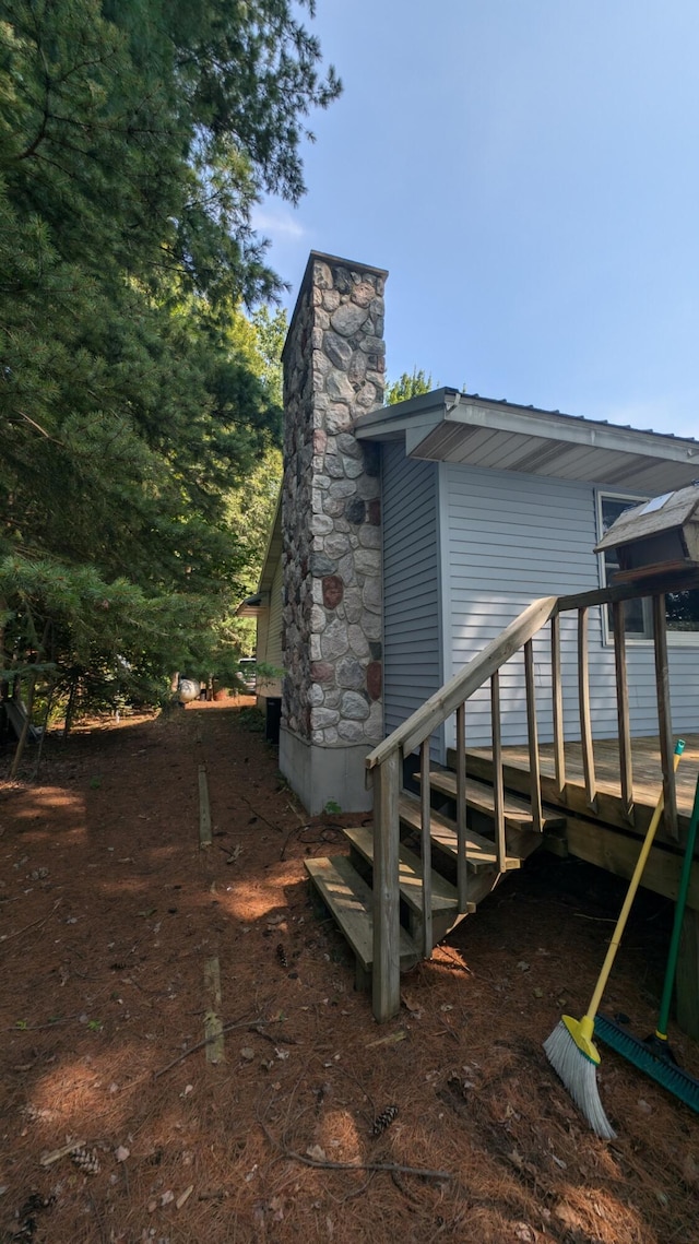 view of property exterior with a chimney