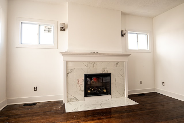 2552 N La Salle Gdns, Detroit, MI 48206 - unfurnished living room featuring a high end fireplace, baseboards, and hardwood / wood-style flooring