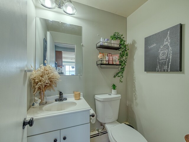 half bath with toilet and vanity